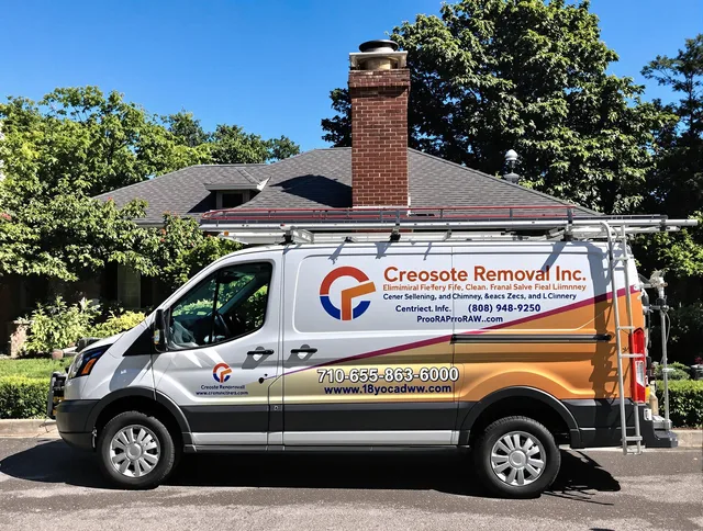 Foxborough Chimney Sweep technician removing creosote safely in Foxborough, MA